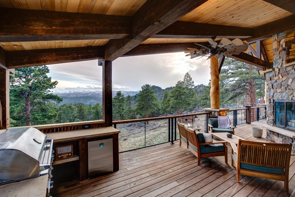 Outdoor seating area with outdoor kitchen and fireplace