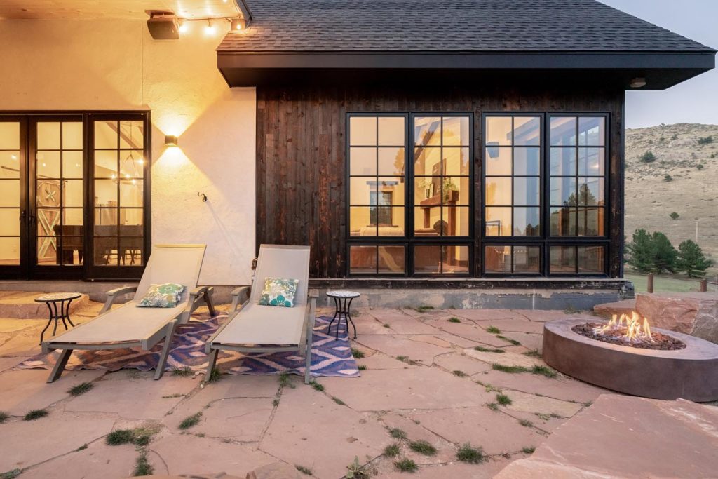 Outdoor patio seating area with fireplace