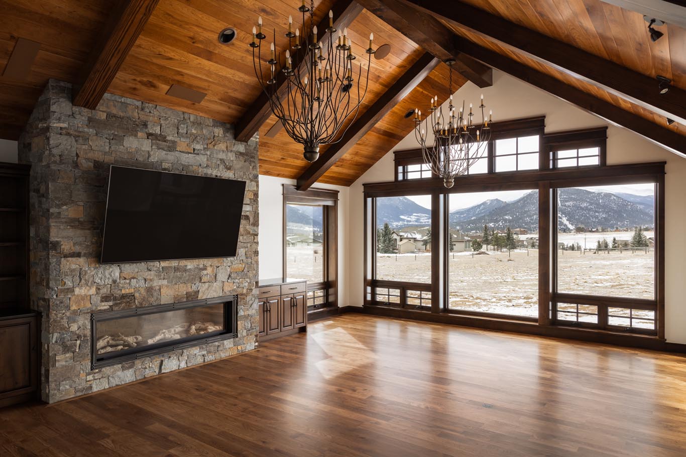 Living room with extravagant chandeliers and fireplace